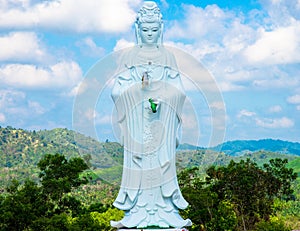 Big Statue of Guanyin on blue sky at Wat Suwan Khiri, Simmulate