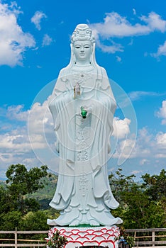 Big Statue of Guanyin on blue sky at Wat Suwan Khiri, Simmulate