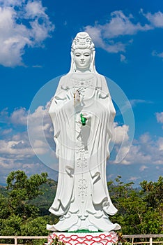 Big Statue of Guanyin on blue sky at Wat Suwan Khiri, Simmulate