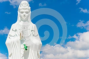 Big Statue of Guanyin on blue sky at Wat Suwan Khiri, Simmulate