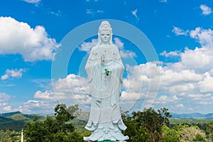 Big Statue of Guanyin on blue sky at Wat Suwan Khiri, Simmulate