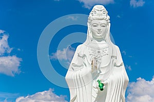 Big Statue of Guanyin on blue sky at Wat Suwan Khiri, Simmulate