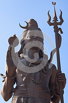 Big statue of Lord Shiva near Delhi International airport, Delhi, India, Lord Shiv big statue touching sky at main highway photo
