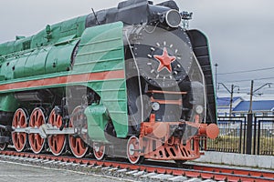 Big steam locomotive with a red star, wheels of old steam locomotives. a pair of wheels. retro locomotives. vintage