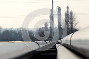 Big steel long pipes go to oil refinery