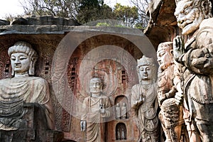 Big stone Buddha on the stone wall at Wuxi Yuantouzhu - Taihu scenery garden, China