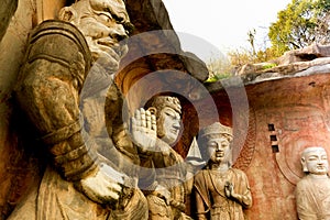 Big stone Buddha on the stone wall at Wuxi Yuantouzhu - Taihu scenery garden, China