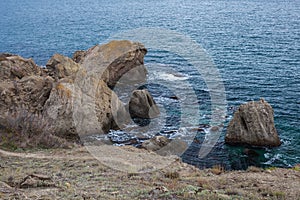 Big stone rock over the sea water