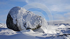 Big Stone snow art on Mount Hoven in Loen in Vestland in Norway