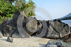 Big stone in the trbig stone in Tansparent sea water with plant and sand, Asia Indonesia