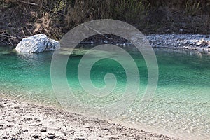 Big stone in the water.