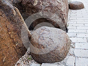Big stones near the paved footpath