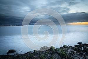 Big storm clouds above north sea drifting over the \'westerschelde\' during sunset,