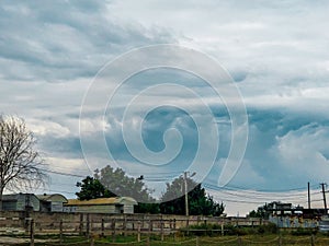 A big storm is coming over the city. Round cyclone. State of the sky before the hurricane