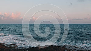 Big stormy ocean waves. Sea waves crashing on rocky beach. Waves hitting rocky seacoast. Beautiful view of stormy ocean. Beautiful