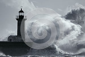 Big stormy wave over lighthouse
