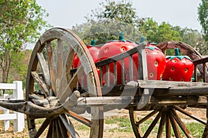 Big strawberry on wooden cart