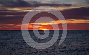 Big sun and sea sunset background. Nature composition.