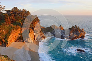 Big Sur, California, United States - Pacific Sunset at McWay Falls on the Pacific Coast, Julia Pfeiffer Burns State Park