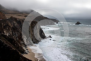 Big Sur Rocky Coastline with Pacific Ocean Waves and Stormy Sky