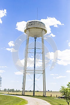 A big and tall white water tower
