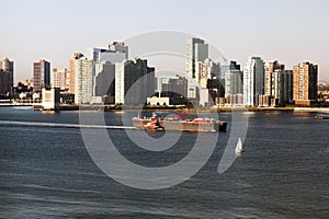 A big tanker passing by Hudson river and New Jersey skyline