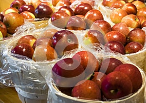 Big and tasty red apples in baskets photo