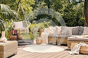 A big terrace with a comfortable leisure sofa with cushions, a t