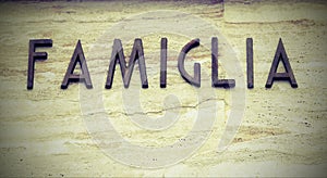 Big text FAMIGLIA that means famiyl in Italy Language with copy photo