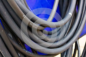 Big thick black cable on blue background
