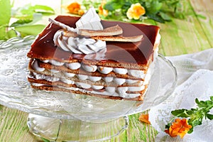 Big tiramisu cake from pastry cream cocoa still life boards lime green yellow cloth beautiful atmosphere