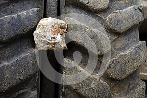 Big tires with a dangerous rock stuck in between