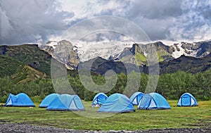 Big tourist camp is located in the valley of the park near the glacier