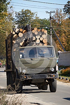 Big truck full of wooden logs