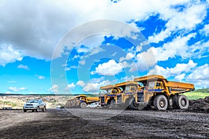 Big truck in open pit and blue sky