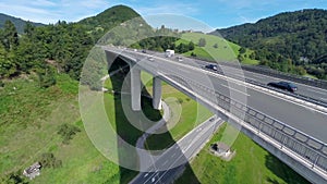 Big truck passing the camera on a bridge of a highway road