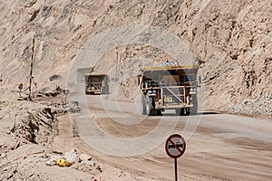 Big trucks and machinery at Chuquicamata, world`s biggest open pit copper mine, Calama, Chile. Mining Operations at open pit