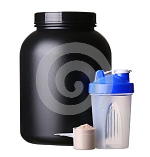 Big tub of whey protein with shaker and cup of protein powder