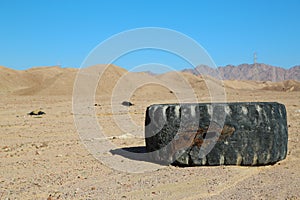 Big tyre lies in desert near Aqaba, Jordan