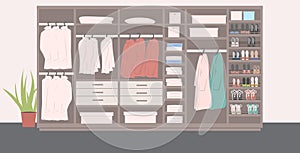 Big wardrobe with different stylish shoes and clothes indoors modern dressing room interior horizontal