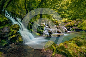 A big waterfall in deep forest in Nera Gorges Romania