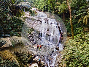 Big waterfall in the green tropical forest