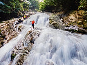 Big waterfall in the green tropical forest