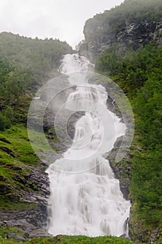 Big waterfall in Norway. Norway, Hjellefossen during cloudy and rainy day. Long exposure