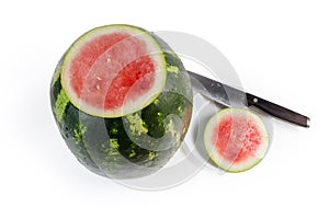 Big watermelon with cut off tip on a white background photo