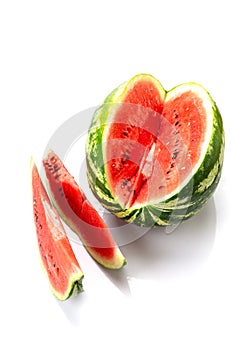 Big watermelon and slice isolated on white background