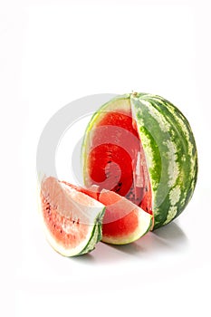 Big watermelon and slice isolated on white background