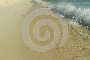 Big wave in Caribbean sea is breaking the coast. Eagle Beach of Aruba Island.