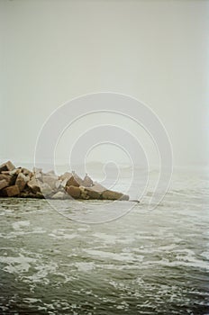 Big wave crashes on the beach shore.