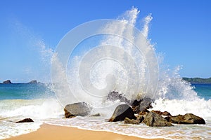 Big wave crashes on to the shore.